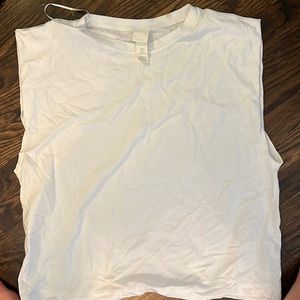 HM white tee with extended arm cutout